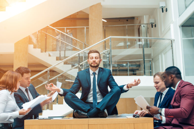 A Man Meditating in the Middle of a Busy Work Day